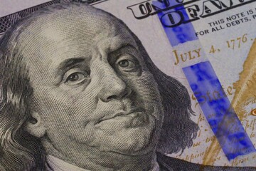 Obraz na płótnie Canvas Ben Franklin portrait on a one hundred dollar currency 