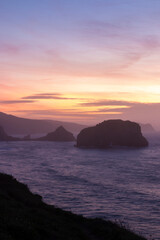 Basque Cliffside Magic: Evening at Gaztelugatxe Unveils Breathtaking Coastal Beauty and Tranquil Serenity