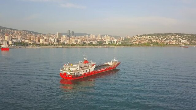 A landing craft anchored 600 meters off the coast at Maltepe in Istanbul. Marmara Sea, Aerial Drone Camera tilts slightly down
