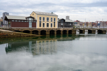 Naklejka premium View on houses, jachts, boats in port of Gijon, Asturias, Spain