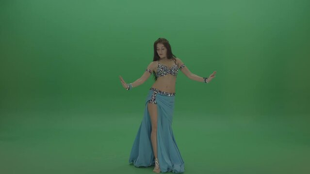 Fascinating belly dancer in blue wear display amazing dance moves over chromakey background