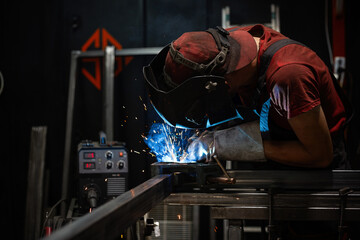Fototapeta man welder, mig or tig welding, craftsman, erecting technical steel Industrial,  steel welder in factory technical obraz