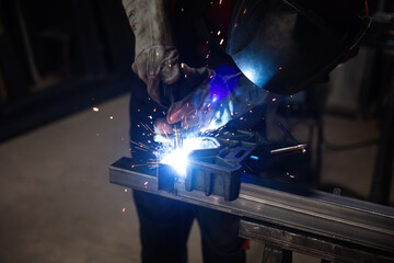 Fototapeta man welder, mig or tig welding, craftsman, erecting technical steel Industrial,  steel welder in factory technical obraz
