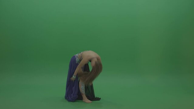 Ravishing belly dancer in purple and black wear display amazing dance moves over chromakey background
