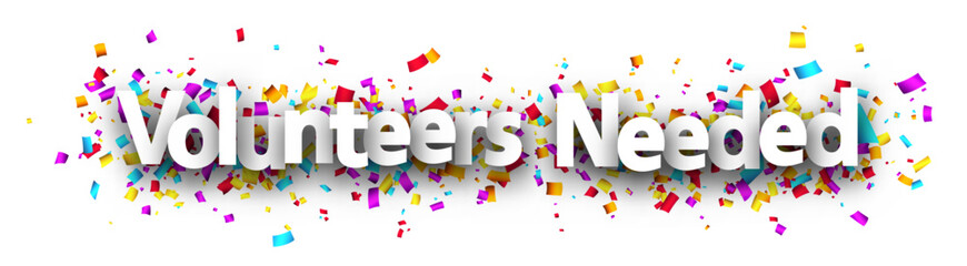 Volunteers needed sign over colorful cut out ribbon confetti background.