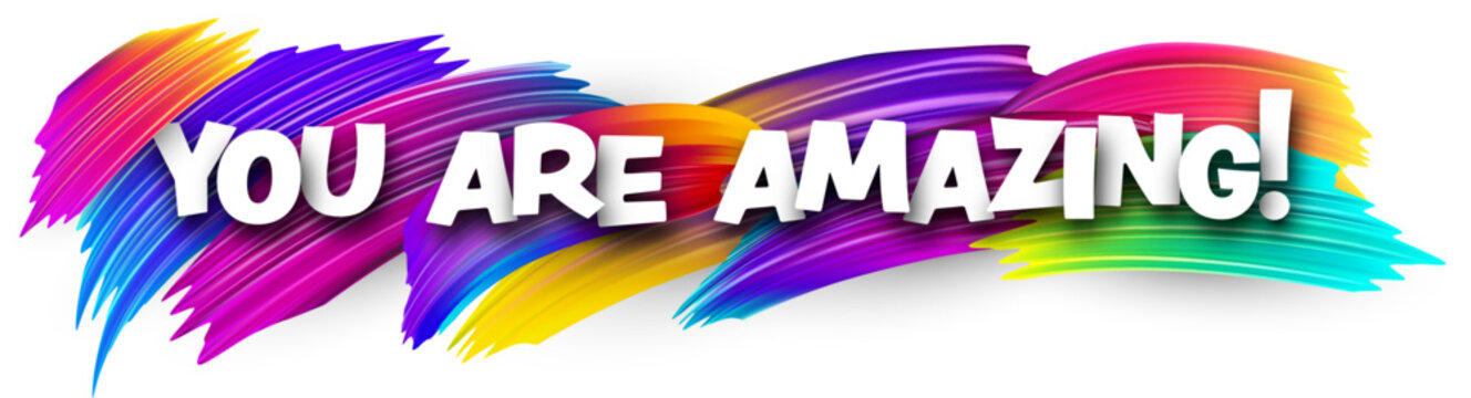 You are amazing paper word sign with colorful spectrum paint brush strokes over white. Vector illustration.