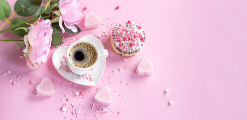 Coffee on a plate in the form of a heart on a pink background. Cupcake. Pink rose. Banner