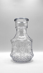 an empty glass jar on a white background 