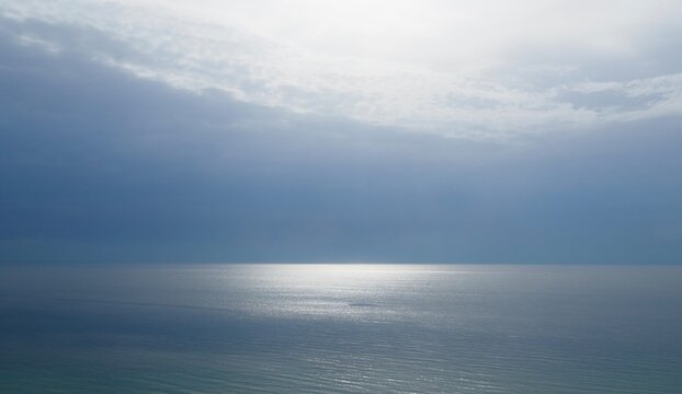 The sun shimmering on a flat calm Atlantic Ocean off the coast of Florida. 