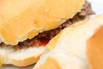 details of the bread known in Brazil as French bread. bread texture. bread with selective focus. ground beef sandwich. bread with minced meat.