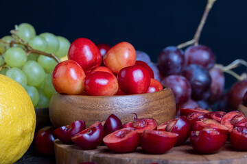Naklejka na ściany i meble Sweet fresh cherries with other products