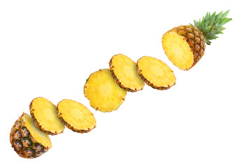 Slices of juicy pineapple flying between its top and bottom on white background