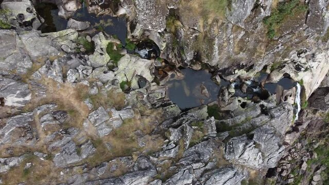 Aerial view over "Frecha da Mizarela" waterfall - the largest waterfall on the Iberian Peninsula. Serra da Freita, Portugal 2023.