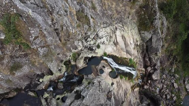 Aerial view over "Frecha da Mizarela" waterfall - the largest waterfall on the Iberian Peninsula. Serra da Freita, Portugal 2023.