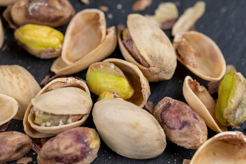 a large number of salty and crispy pistachios close-up