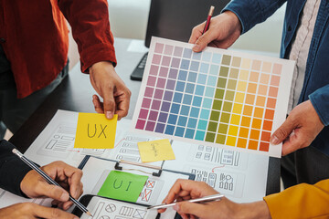 UI, UX designers developers Group team meeting often fill variety of roles in prototyping, product...