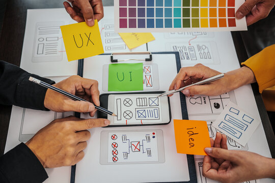 UI, UX designers developers Group team meeting often fill variety of roles in prototyping, product development and adds new ideas to mix, helps set stage for better collaboration during build phase.