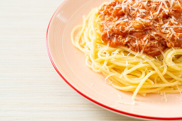 pork bolognese spaghetti with parmesan cheese