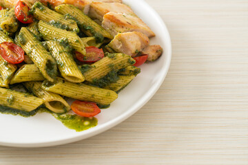 penne pasta in pesto sauce with grilled chicken