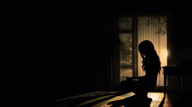 silhouette of a depression woman fictional in the dark room 