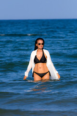 Woman body pretty with black  bikini on beach
