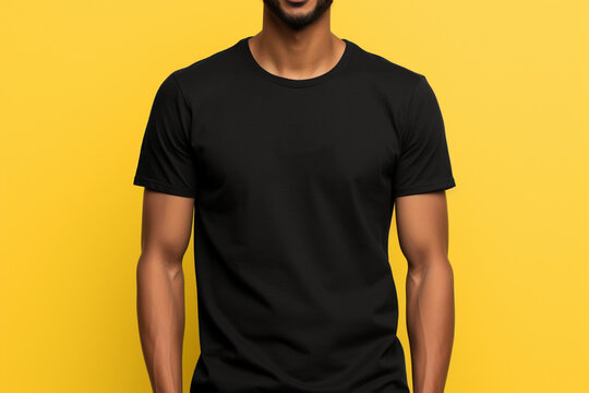 modern style with an image of a young man confidently sporting a Bella Canvas black T - shirt mockup against a vibrant yellow background