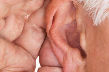 Naklejka premium Close-up Of A Man Trying To Hear