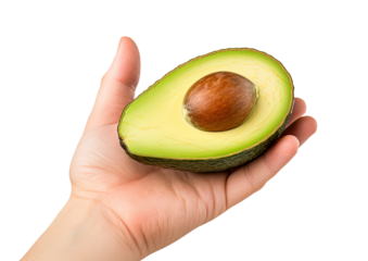 Hand holding halved avocado isolated on transparent background