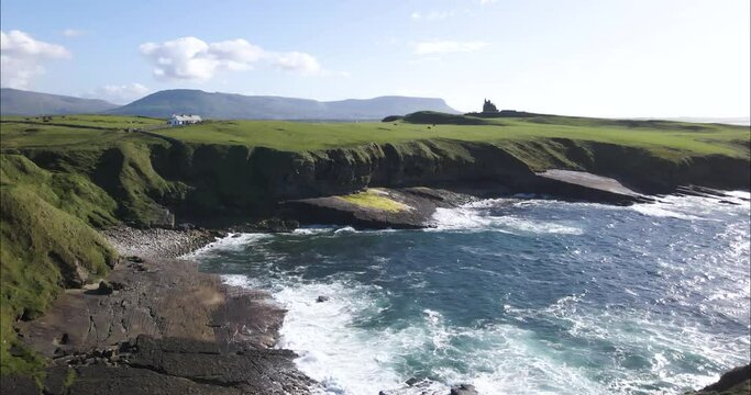 Person Standing on Breathtaking Ireland Coastline in Sligo Country, Ireland - Aerial