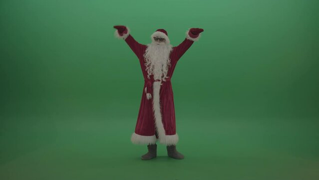 Santa with much swagger over the green screen background