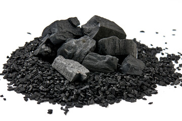 Pile of natural activated carbon scattered isolated on white background. activated carbon is used for effective applications in adsorption, removal of pollutants, water treatment, and energy, etc.