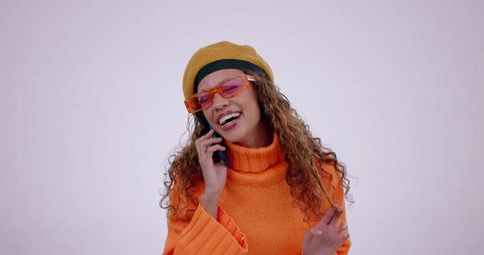 Happy, stylish and woman on a phone call with a studio background for communication. Smile, thinking and a girl or model speaking on a mobile for conversation or chat with fashion style on a backdrop