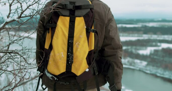 camera following after walking hicker with backpack Slow motion back rare view, Slow motion, winter holiday, extreme, guy training outdoors active fit lifestyle.