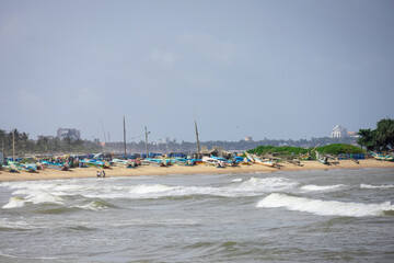 Fototapeta na wymiar Fishing boats parked on the sand, fishing industry in Sri Lanka