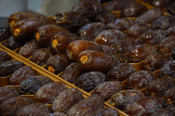 A pile of appetizing dried date medjool fruits placed on stall in local market