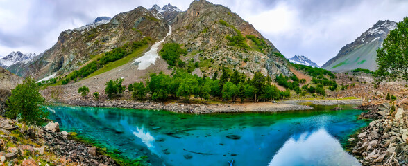 colorful lake and the mountains under sky