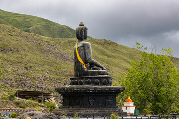 Statue of Siddhartha Gautam Buddha overlooking the Muktinath Village in Upper Mustang, Nepal