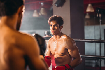 Fototapeta na wymiar Boxer's determination shines in rounds, contesting with devotion to showcase Thai martial art skills