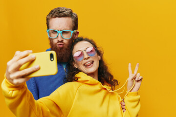Woman and man funny couple with phones hand social networking and communication crooked do selfies...