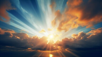 Fototapeta premium Sunset with sun and clouds on blue and orange dramatic sky with sun rays