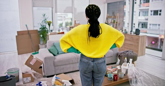 Cleaning, woman and back with messy living room and lounge at home with maintenance. Worker, house and maid frustrated and tired from housekeeping chaos with care with female cleaner and service