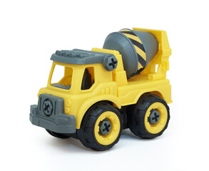 Yellow plastic concrete mixer truck toy isolated on white background. construction vechicle truck.