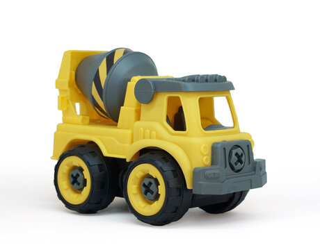 Yellow plastic concrete mixer truck toy isolated on white background. construction vechicle truck.