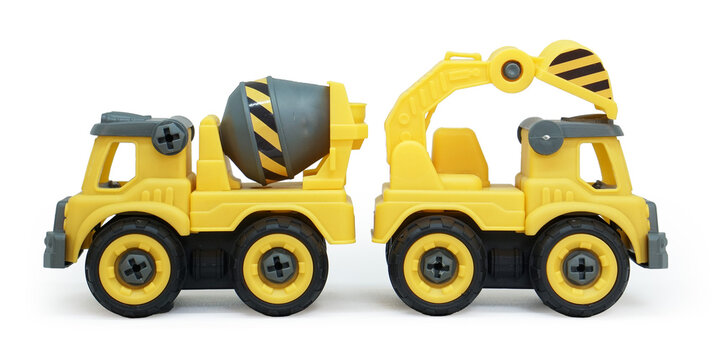 yellow plastic toy of concrete mixer and ecavator truck isolated on white background. heavy construction vehicle.