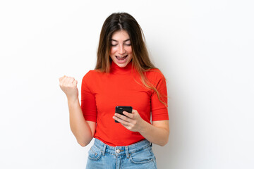 Young caucasian woman isolated on white background surprised and sending a message