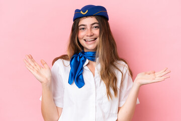 Airplane stewardess caucasian woman isolated on pink background with shocked facial expression