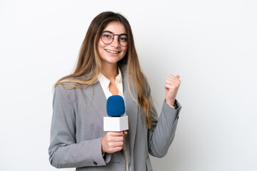 Young caucasian TV presenter woman isolated on white background pointing to the side to present a...