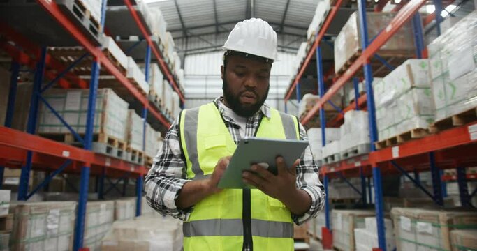Warehouse working checking stock data in digital tablet in wearhouse