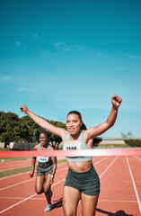 Happy woman, running and winning by finish line in race, competition or marathon on outdoor stadium...