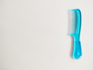 blue comb isolated on white background
